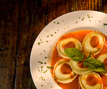 close up photo of ravioli with marinara